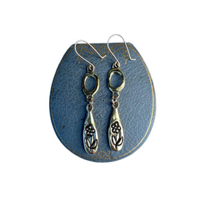 Serpentine cast forget me not earrings