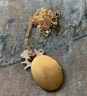vintage oval brass locket neckalce with mother of pearl lion charm zodiac jewelry