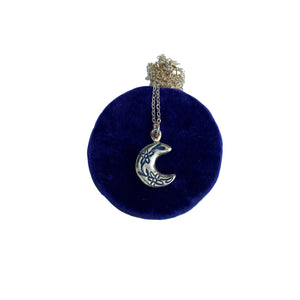 Serpentine cast floral moon charm necklace