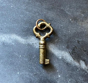 small antique key charm