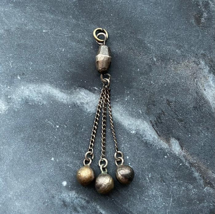 antique silvery tassel charm