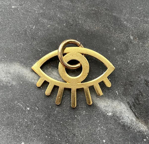 brass evil eye charm