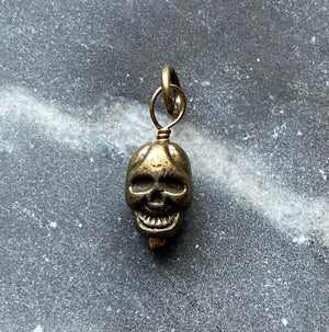 vintage brass skull charm