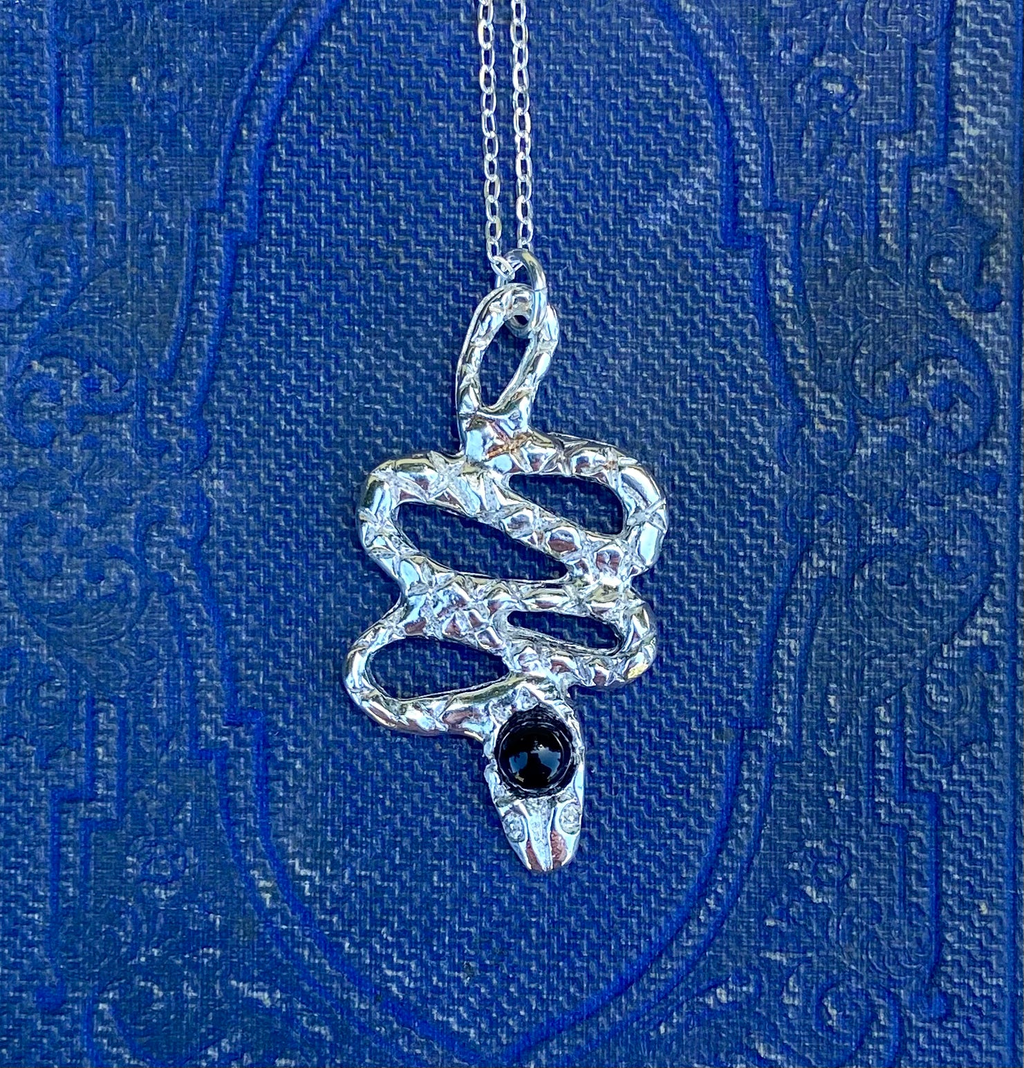 serpentine handmade hand carved lost wax cast brass crystal snake charm necklace witchy talisman jewelry