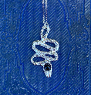 serpentine handmade hand carved lost wax cast brass crystal snake charm necklace witchy talisman jewelry