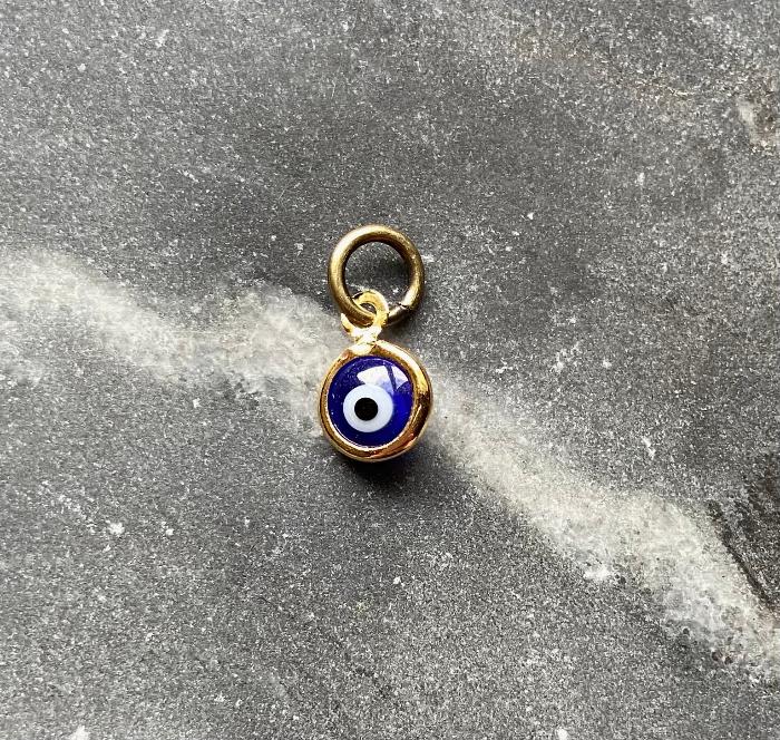 small gold plated dark blue evil eye charm