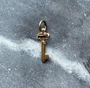 small gold plated key charm