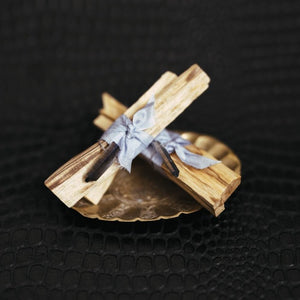 palo santo wood bundle tied with a crystal
