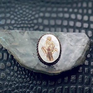 vintage carved shell Aquarius cameo brooch.