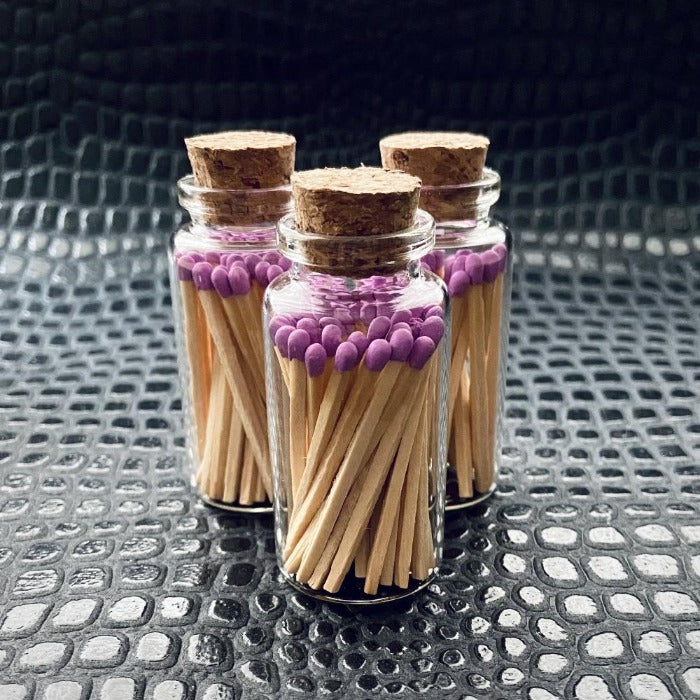 Mini match bottle with purple matches and cork top