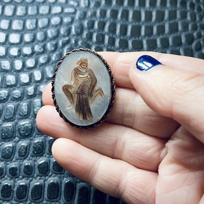 vintage carved shell Aquarius cameo brooch.