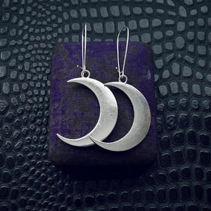 witchy silvery crescent moon statement earrings