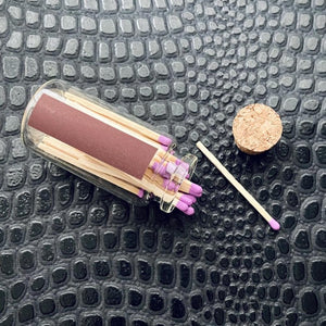 Mini match bottle with purple matches and cork top